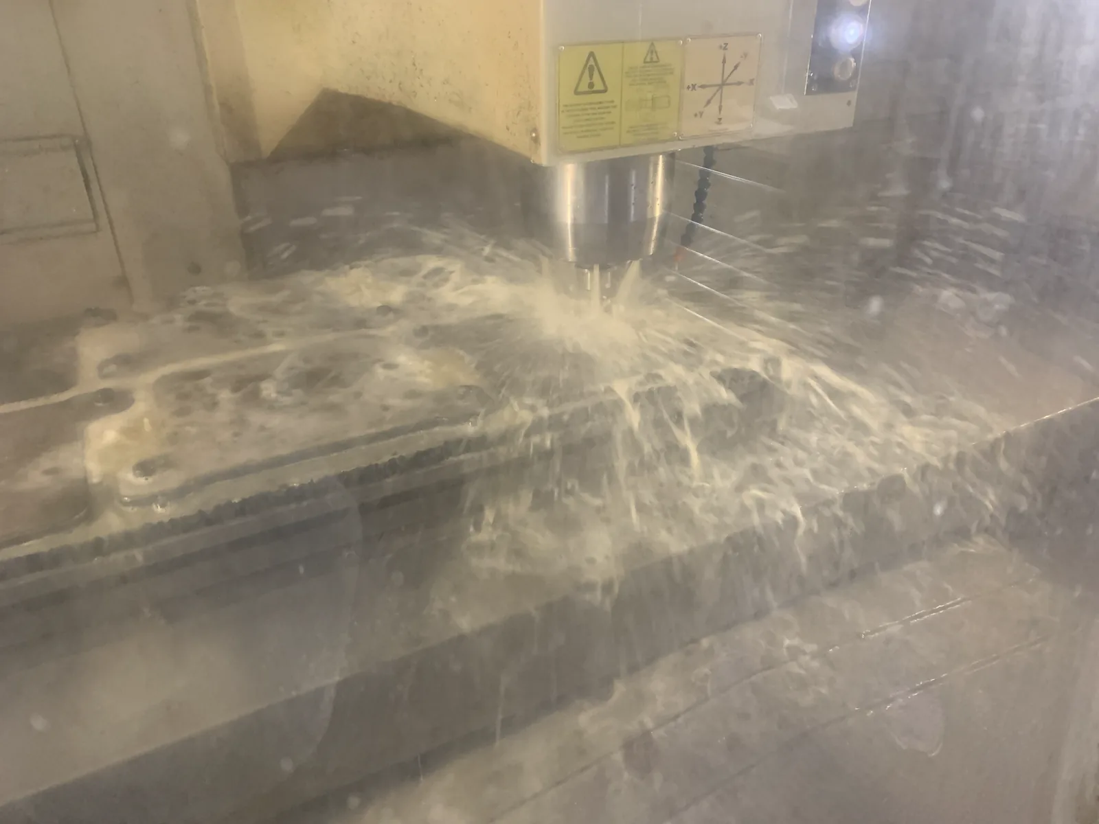 Bridgeport GX 1000 OSP machining a part